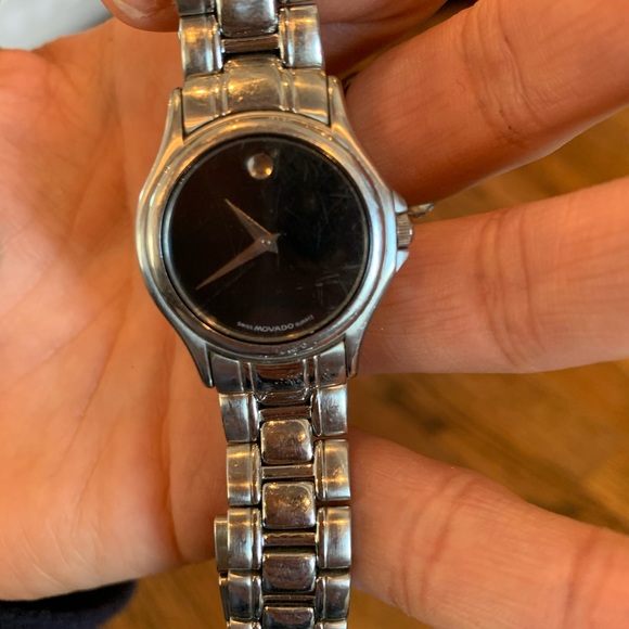 Movado woman’s watch. Black face. Stainless steel